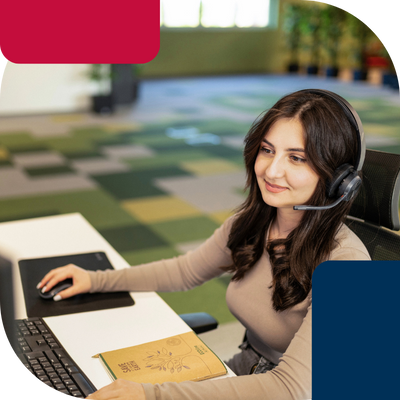 Ameripol_BackOffice_female-sitting-infront-off-computer-with-headphone-set
